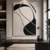 Modern black and cream abstract canvas wall art featuring flowing organic forms in a contemporary minimalist design.