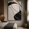 Modern black and cream abstract canvas wall art featuring flowing organic forms in a contemporary minimalist design.