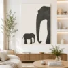 Minimalist mother and calf elephant canvas wall art featuring textured charcoal silhouettes on a neutral background for modern luxury interiors.
