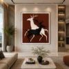 Luxury minimalist running deer canvas wall art featuring contrasting black and cream silhouettes against a warm terracotta background.