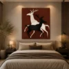 Luxury minimalist running deer canvas wall art featuring contrasting black and cream silhouettes against a warm terracotta background.