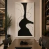 Modern black and cream abstract canvas wall art featuring a bold sculptural silhouette with flowing contour lines.