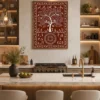 Luxury Warli Tree of Life canvas wall art featuring white tribal illustrations of birds, deer, village life, and a sacred tree on a terracotta background with a dark gallery frame.