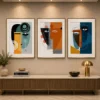 Luxury Cubist triptych canvas wall art featuring geometric abstract faces in terracotta, navy, sage green, and mustard tones with contemporary gallery styling.