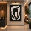 Modern black and cream abstract canvas wall art featuring layered organic rings with sculptural contemporary design.